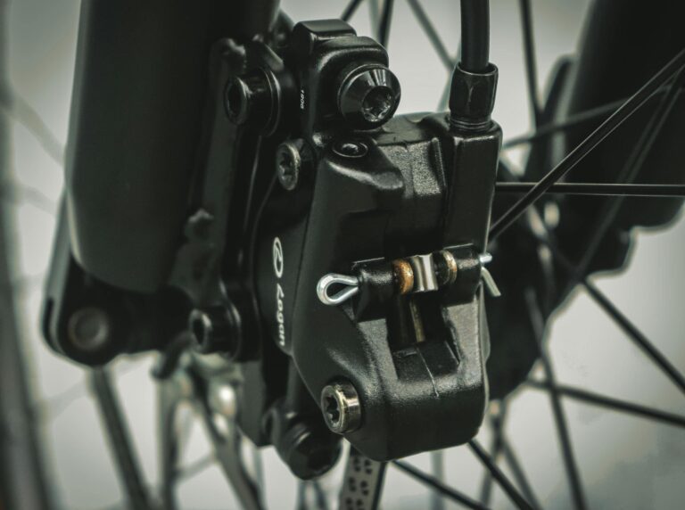 Detailed macro of bicycle brake showcasing mechanical components and engineering.