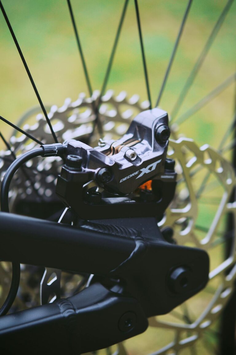 Detailed view of a mountain bike braking system showcasing the disc and caliper in focus.